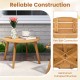Round outdoor acacia wood side table with slatted tabletop and reinforced X-shaped structure for patio or garden use.