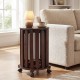Round portable wood nesting stool in walnut finish with locking casters, ideal for small spaces and easy mobility.