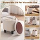 Round beige storage ottoman with removable lid, serving as a footrest or side table, perfect for modern living spaces.