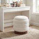 Round storage ottoman in white boucle fabric with acacia wood frame, featuring hidden storage and 360° swivel for.