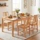 Natural rubber wood dining chairs set of 4 with ergonomic hollowed backrest, arranged around a dining table.
