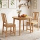 Natural rubber wood dining chairs with hollowed backrest, showcasing ergonomic design and timeless beauty in a cozy.