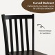 Curved black slat backrest of rustic wooden dining chair, designed for comfort and ventilation in kitchen or dining.