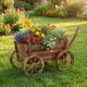 Rustic rolling flower pot stand made of fir wood with vibrant flowers, featuring wheels and an adjustable handle for.