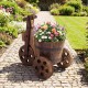 Rustic wood tricycle planter barrel with flowers, crafted from fir wood, featuring drainage hole for outdoor decoration.