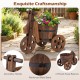 Rustic wood tricycle planter barrel with drainage hole, reinforced metal band, and three wheels for stability.