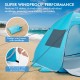 Automatic pop-up beach tent in blue with wind ropes, stakes, and sandbags for enhanced stability and safety on the.