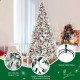 8-foot snow flocked Christmas tree with berries and poinsettia flowers, featuring a sturdy metal base for stability.