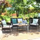 Cushioned wicker conversation set with acacia wood tabletop, perfect for outdoor patio or garden relaxation.