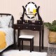 Elegant brown vanity table set with lighted mirror, cushioned stool, and ample storage for cosmetics and jewelry.