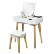 Wooden vanity table with flip top mirror, cushioned stool, and spacious storage for makeup and accessories.