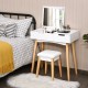 Wooden vanity table with flip top mirror, cushioned stool, and sturdy solid wood legs for stylish bedroom storage.