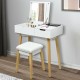 Wooden vanity table with flip top mirror, cushioned stool, and sturdy solid wood legs for stylish and functional.