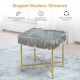Gray faux fur ottoman with golden metal legs, stylish design for small spaces, ideal for bedroom or living room use.