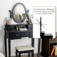 Vanity table set with oval mirror, 12 LED bulbs, and 5 drawers in black, perfect for makeup and writing.
