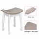 Concave seat stool with thick padding and elegant white legs, perfect for a vanity dressing table set.
