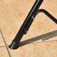 Close-up of the black steel frame base of the loveseat cushioned patio swing glider, designed for outdoor relaxation.