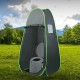 Portable travel toilet in a privacy tent, featuring a paper holder, designed for outdoor use and compact storage.