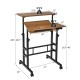 Mobile standing desk with adjustable height and tilting surface in walnut finish, ideal for small spaces and versatile.