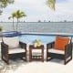 Patio wicker furniture sofa set with beige cushions and acacia wood frame, perfect for outdoor relaxation by the pool.