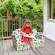 Double kids dinosaur sofa with soft velvet surface, perfect for reading or lounging indoors or outdoors.