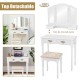 Simple white vanity set with tri-fold mirror, four drawers, and cushioned stool for comfortable makeup application.