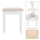 Cushioned stool with floral pattern and white legs, part of a sturdy vanity set for comfortable makeup application.