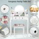Vanity table set with oval mirror, white finish, four drawers, and cushioned stool for stylish makeup organization.