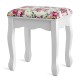 Cushioned stool with floral pattern, part of a white makeup vanity set, perfect for girls' dressing tables.