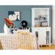 Freestanding white kitchen pantry with hutch, sliding doors, and drawers, providing ample storage for kitchen supplies.