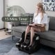 Foot and calf massager in black with heat and vibration features, designed for relaxation and pain relief, with.