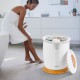Bathroom towel warmer bucket in use, heating towels with fragrance holder, compact design for easy portability.