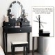 Black vanity dressing table set featuring a 360-degree rotatable mirror and three storage drawers for cosmetics.
