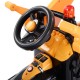 Close-up of the steering wheel and controls of the yellow 12V battery-powered kids ride-on dumper truck for imaginative.