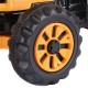 Close-up of the yellow tire on the 12 V battery-powered kids ride-on dumper truck, designed for outdoor play and.