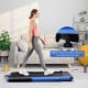 Folding treadmill in use with adjustable incline, featuring a 2.25 HP motor for quiet walking and running at home.