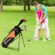 Junior golf club set for children aged 11-13, featuring an orange stand bag and various clubs for beginners.