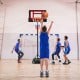 Portable basketball hoop with adjustable height from 4.3FT to 8.2FT, featuring built-in wheels for easy mobility.