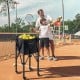 Lightweight foldable tennis ball teaching cart in blue with removable bag, holding 150 balls, ideal for easy transport.