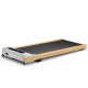 Under desk treadmill side view, showcasing the sleek design and remote control for convenient home office workouts.