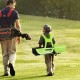 Junior complete golf club set in green with stand bag, adjustable straps, and rain hood, perfect for kids aged 5-7.