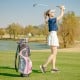 Women's complete golf club set in pink with rain hood, featuring a 14-way top organizer and insulated cooler bag.