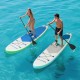 Two people paddle on 11-foot inflatable SUP boards in clear water, showcasing stability and safety features.