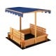 Kids wooden sandbox with blue canopy and two convertible bench seats, perfect for outdoor play and relaxation.