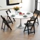 Foldable black dining chairs with rubber wood legs and padded seats, ideal for home office or event seating.