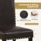 Close-up of a thick padded seat of a faux leather dining chair with nailhead accents, ideal for kitchen or dining areas.