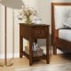 Contemporary walnut side end table with drawer and shelf, perfect for compact spaces in bedrooms or living rooms.