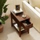Contemporary walnut side end table featuring a drawer and shelf, perfect for compact living spaces and home decor.