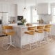 Counter height stool set with armless design, orange corduroy seat, and metal base, ideal for kitchen counters.