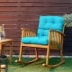 High back chair cushion in turquoise with adjustable height, thick padding, and secure rope straps for outdoor comfort.